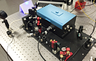 Powerful source of CW tunable ultra-narrow-linewidth radiation in 
UV-blue-green range